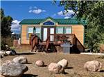 One of the yellow camping cabins at OASIS DURANGO RV RESORT - thumbnail