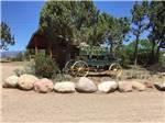 An old wagon with "welcome y'all" painted on the side at OASIS DURANGO RV RESORT - thumbnail