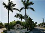 White stone front entrance fountain surrounded by palm trees at BOYD'S KEY WEST CAMPGROUND - thumbnail