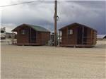 A row of rental cabins at WESTERN HILLS CAMPGROUND - thumbnail