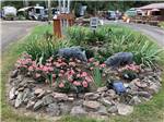 A flower planter with two statues at WOLF LODGE CAMPGROUND - thumbnail