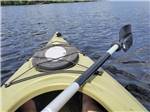 Front view of a kayak in the lake at FIELD & STREAM RV PARK - thumbnail