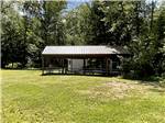 The pavilion with picnic tables at FIELD & STREAM RV PARK - thumbnail