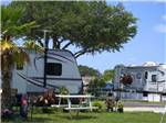 A camper adds personal flair to an RV spot at KISSIMMEE RV PARK - thumbnail