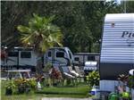 RV spots decorated with lawn items at KISSIMMEE RV PARK - thumbnail