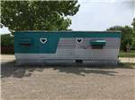 A teal and white vintage trailer at DALLAS HI HO RV PARK - thumbnail