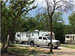 A truck in a paved RV site at DALLAS HI HO RV PARK - thumbnail