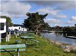 A row of RV sites on the water at CAMPLAND ON THE BAY - thumbnail