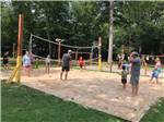 Campers playing volleyball at STONEBRIDGE RV RESORT - thumbnail