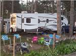 Trailers camping at campsite at LAKE DUBAY SHORES CAMPGROUND - thumbnail