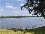 A boat on the water in daytime at LAKE DUBAY SHORES CAMPGROUND - thumbnail