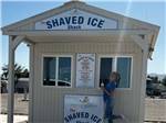 A girl in front of the Shaved Ice Shack at NEEDLES MARINA RESORT - thumbnail