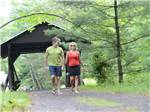 Couple walking in the park at LAKE GEORGE RV PARK - thumbnail