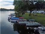 RVs parked by boats docked at WAFFLE FARM CAMPGROUNDS - thumbnail