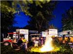 A group of kids sitting by a fire at WAFFLE FARM CAMPGROUNDS - thumbnail