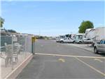RVs and truck and trailers parked in lot at MARIN RV PARK - thumbnail