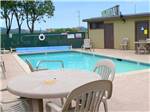 Swimming pool with outdoor seating at MARIN RV PARK - thumbnail