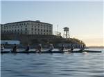A group of people rowing next to Alcatraz Prison at MARIN RV PARK - thumbnail