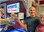 Campers ordering Hershey's ice cream in waffle cone at GETTYSBURG CAMPGROUND - thumbnail