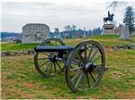Civil war cannons and statues in Gettysburg at GETTYSBURG CAMPGROUND - thumbnail