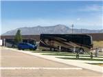 A row of paved RV sites at CENTURY RV PARK & CAMPGROUND - thumbnail