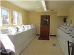 Laundry room with washer and dryers at LOVELAND RV RESORT - thumbnail
