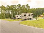 Two travel trailers parked in paved sites at SUN OUTDOORS OCEAN CITY GATEWAY - thumbnail