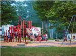 Playground with swing set at PATTEN POND CAMPING RESORT - thumbnail