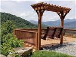 A swinging bench seat overlooking the valley at MAMA GERTIE'S HIDEAWAY CAMPGROUND - thumbnail