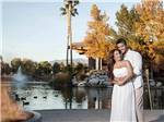 Newlyweds in front of lake at LAKESIDE CASINO & RV PARK - thumbnail