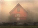 One of the cabins surrounded by fog at CAMPFIRE LODGINGS - thumbnail