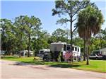 RVs and truck and trailers camping at WINTER GARDEN - thumbnail