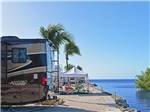 RVs backed in next to the ocean at ENCORE FIESTA KEY - thumbnail