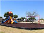 The colorful playground equipment at FUN TOWN RV PARK AT WINSTAR - thumbnail