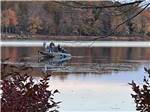 A group of people fishing from a boat at CLAYTON PARK RV ESCAPE - thumbnail