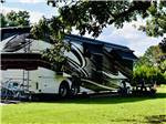 A motorhome parked at a site at RED GATE FARMS - RV RESORT - thumbnail
