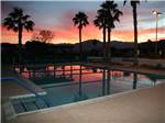 Swimming pool at sunset at INDIAN WATERS RV RESORT & COTTAGES - thumbnail