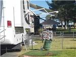 RV parked with fence for pet at THE RV PARK AT THE PIMA COUNTY FAIRGROUNDS - thumbnail