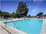 Swimming pool with outdoor seating at THOUSAND TRAILS OAKZANITA SPRINGS - thumbnail