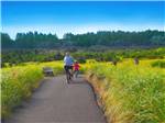 Mother and daughter biking at THOUSAND TRAILS LONG BEACH - thumbnail