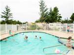 Kids swimming in pool at THOUSAND TRAILS LONG BEACH - thumbnail