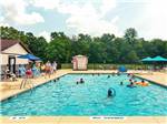 People swimming in pool at THOUSAND TRAILS WILMINGTON - thumbnail
