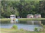A row of rental cabins by the lake at BEAVER RUN RV PARK - thumbnail
