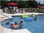 People playing in a pool at SCENIC MOUNTAIN RV PARK & CAMPGROUND - thumbnail