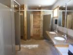 Bathroom with sinks, stalls and showers at HTR NIAGARA - thumbnail