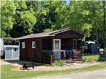 One of the rental rustic cabins at LEAFY OAKS CAMPGROUND - thumbnail