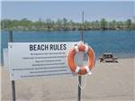 The beach rule sign with a lifesaver at KEARNEY RV PARK & CAMPGROUND - thumbnail
