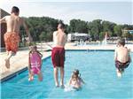 A group of kids jumping into the pool at CAMP TURKEYVILLE RV RESORT - thumbnail