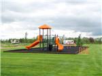 The playground area with slides at CAMPLAND RV RESORT - thumbnail
