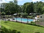 The fenced in pool area at WHISPERING PINES CAMPING ESTATES - thumbnail